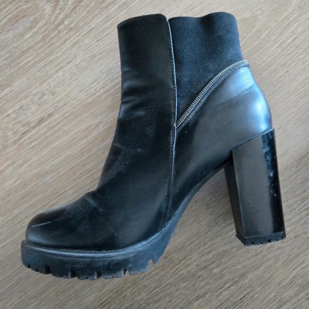 Sleek Black Leather Heeled Boots